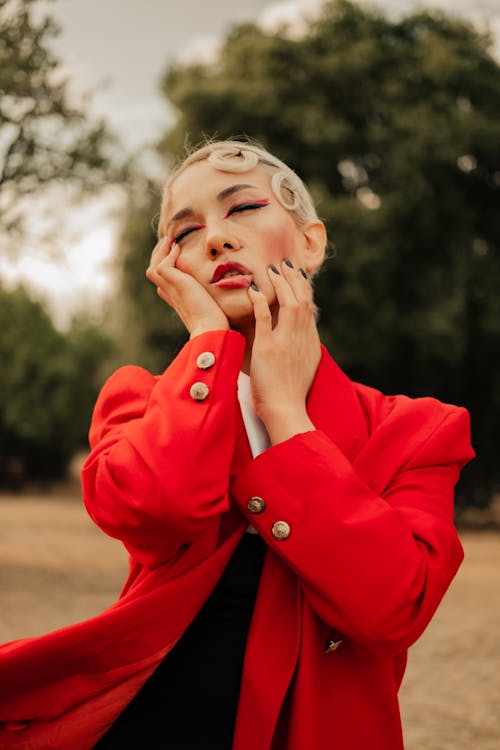 Shallow Focus of a Woman in Red Suit