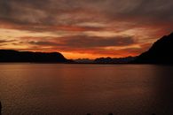 Silhouette of Mountain Near Body of Water during Sunset