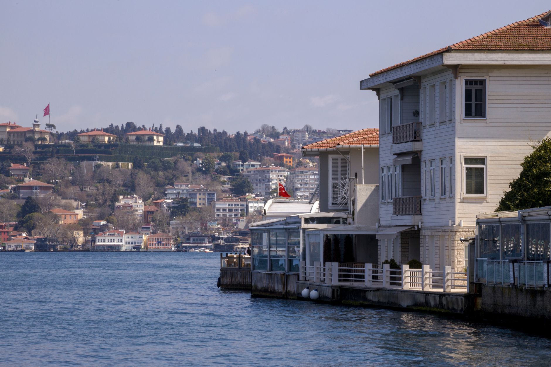 Traditional houses along the Bosphorus Strait in Istanbul with a scenic coastal view.