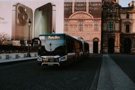 Green and Black Bus on the Road