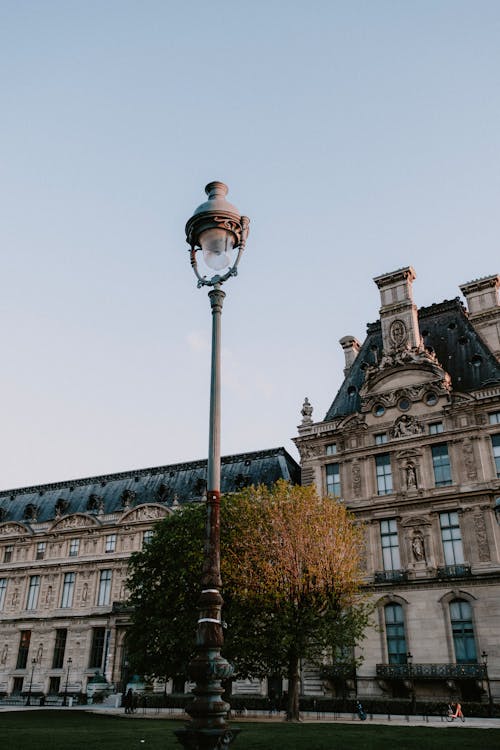 A Lamp Post Near a Concrete Building