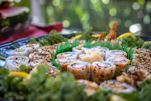 A vibrant platter of assorted sushi rolls with fresh garnish, perfect for a gourmet Asian cuisine experience.