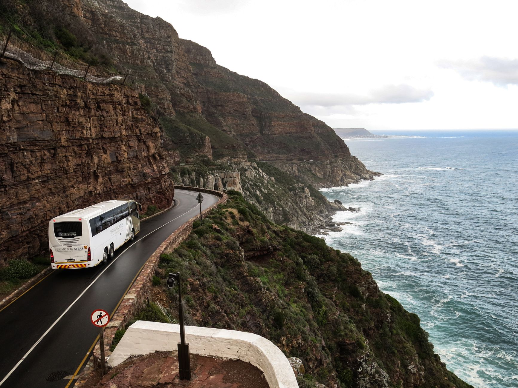 A scenic road trip along dramatic coastal cliffs in South Africa, ideal for travel and adventure.