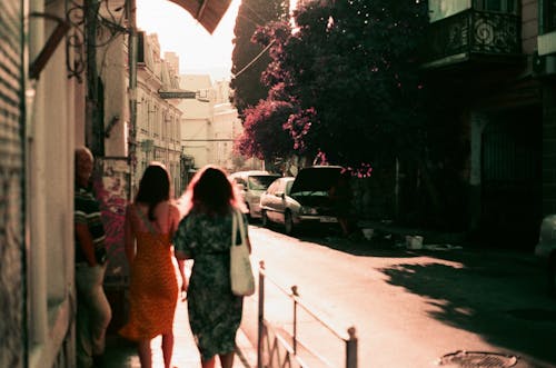 Back View of Women Walking on a Street