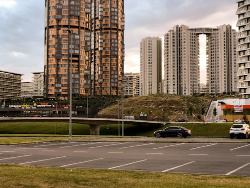 View of a Parking Lot and Modern Skyscrapers in City 