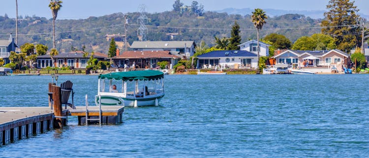 Boat On Lake Near Houses