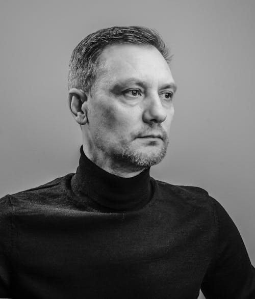 Grayscale Photo of a Man in Black Turtleneck Sweater