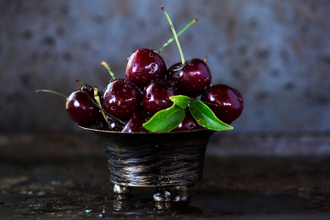 Red Cherries on Stainless Steel Bowl