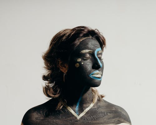 Portrait of Woman with Black and Blue Face Paint