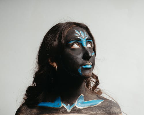 Close-up Photo of Woman with Face Paint 