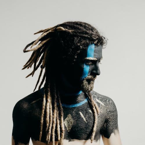 Free Portrait of Man in Blue and Black Face Paint Stock Photo
