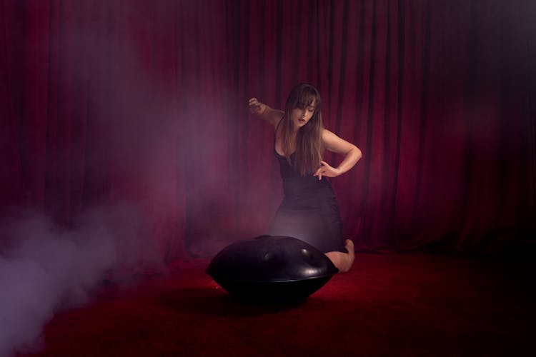 Photo Of A Woman Playing A Steelpan