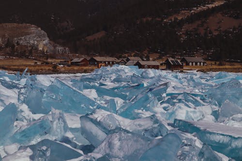 Ice Berg Near Brown Houses