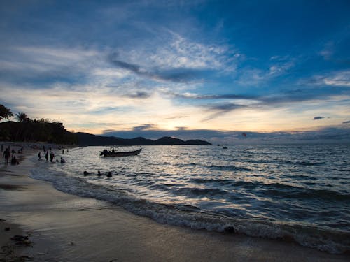 People on the Beach during Sunset