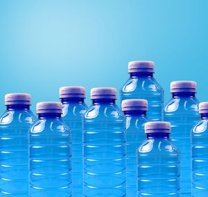 Group of plastic bottles on a gradient background — photo by Mateusz Feliksik on Pexels