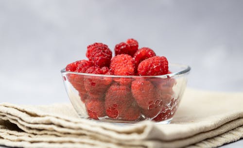 Free Close-Up Photograph of a Bowl with Raspberries Stock Photo