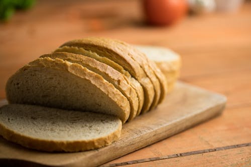 Free Sliced Bread on Wooden Board Stock Photo