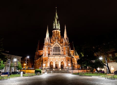 Stunning view of St. Joseph's Church in Krakow, Poland, beautifully illuminated at night.