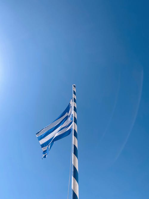 A Greece Flag on a Flag Pole