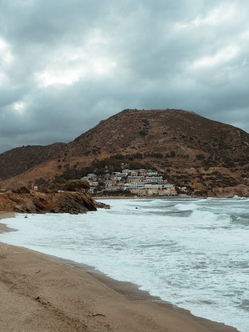 Sea on Sand Beach in Mountains Landscape