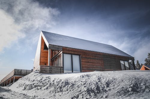 A House in the Mountain Covered in Snow