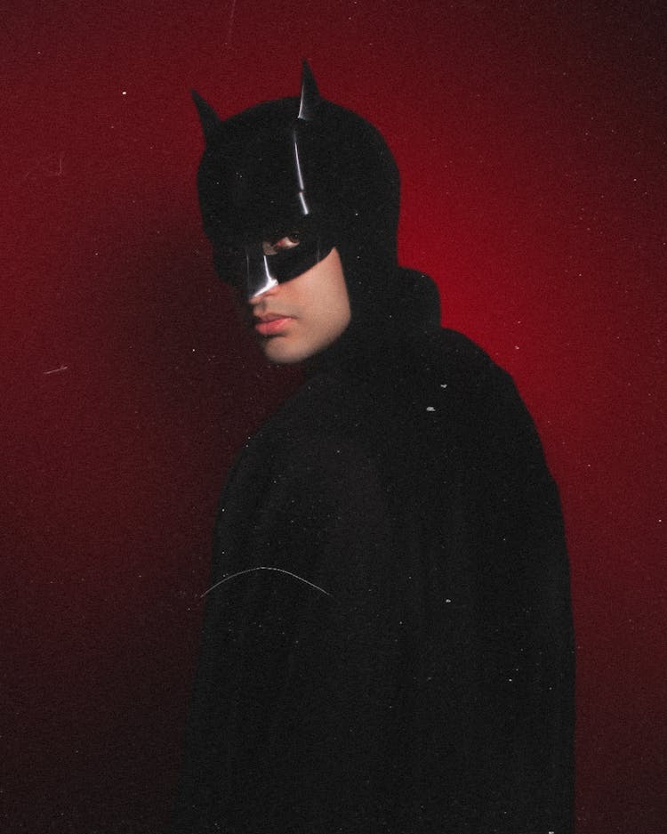 Photograph Of A Man Wearing A Batman Mask