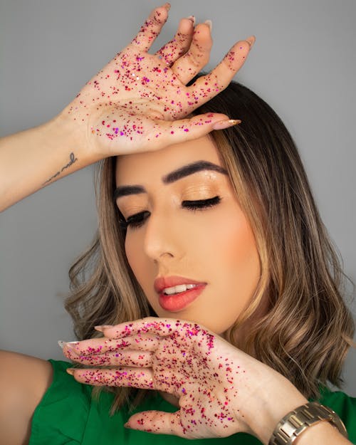Free Woman with Glitters on her Hands Stock Photo