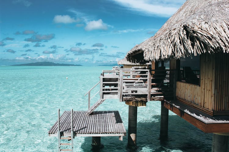 Brown Nipa Hut On Body Of Water