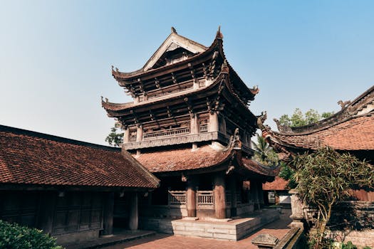 Explore the ancient Keo Pagoda's intricate architecture against a vibrant blue sky in Thái Bình, Vietnam.