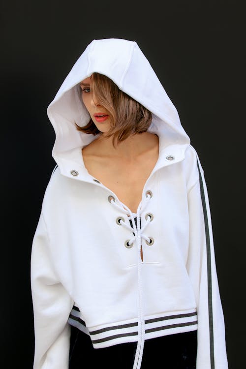 Woman Posing in a White Hoodie 