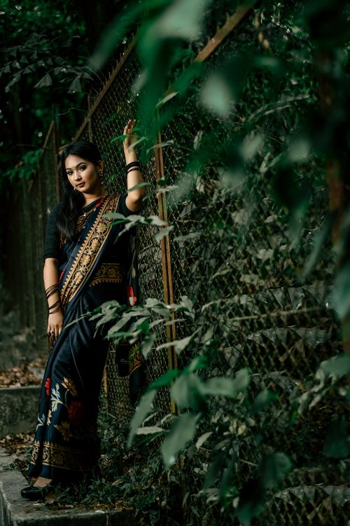 Elegant Woman in Traditional Bengali Saree Outdoors · Free Stock Photo