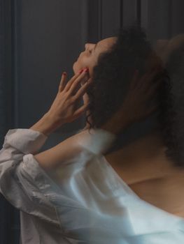 Creative image of woman with artistic motion blur effect indoors.