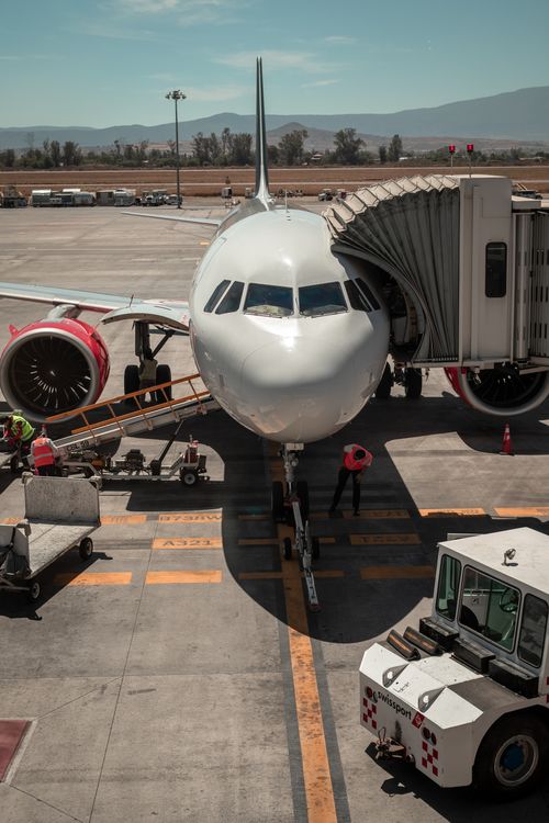 Free Front view of a commercial airplane docked at Guadalajara Airport, Mexico. Stock Photo