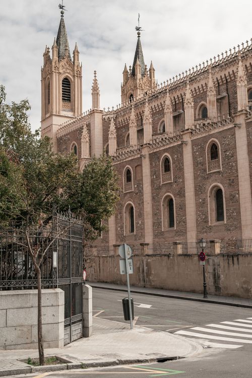Free A stunning cathedral with Gothic architecture in Madrid's urban landscape. Captivating for architectural enthusiasts. Stock Photo