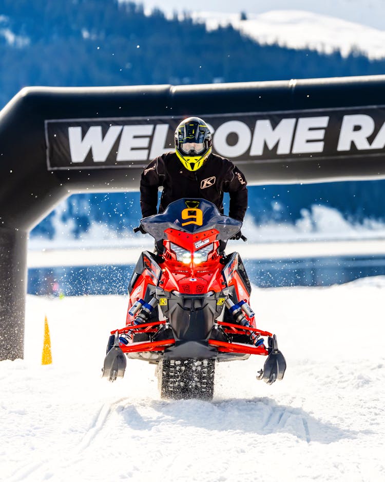 Person Riding On A Snowmobile