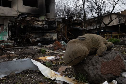 Devestating aftermath in Borodyanka, Ukraine, with debris and a toy in the rubble.