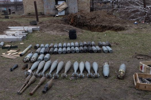 Artillery and Mortar Shells Spread Out in the Yard