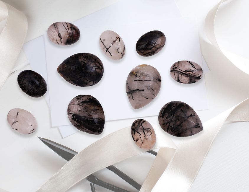 Pink tourmaline gemstone photographed close up, showing soft rose color and natural crystal texture