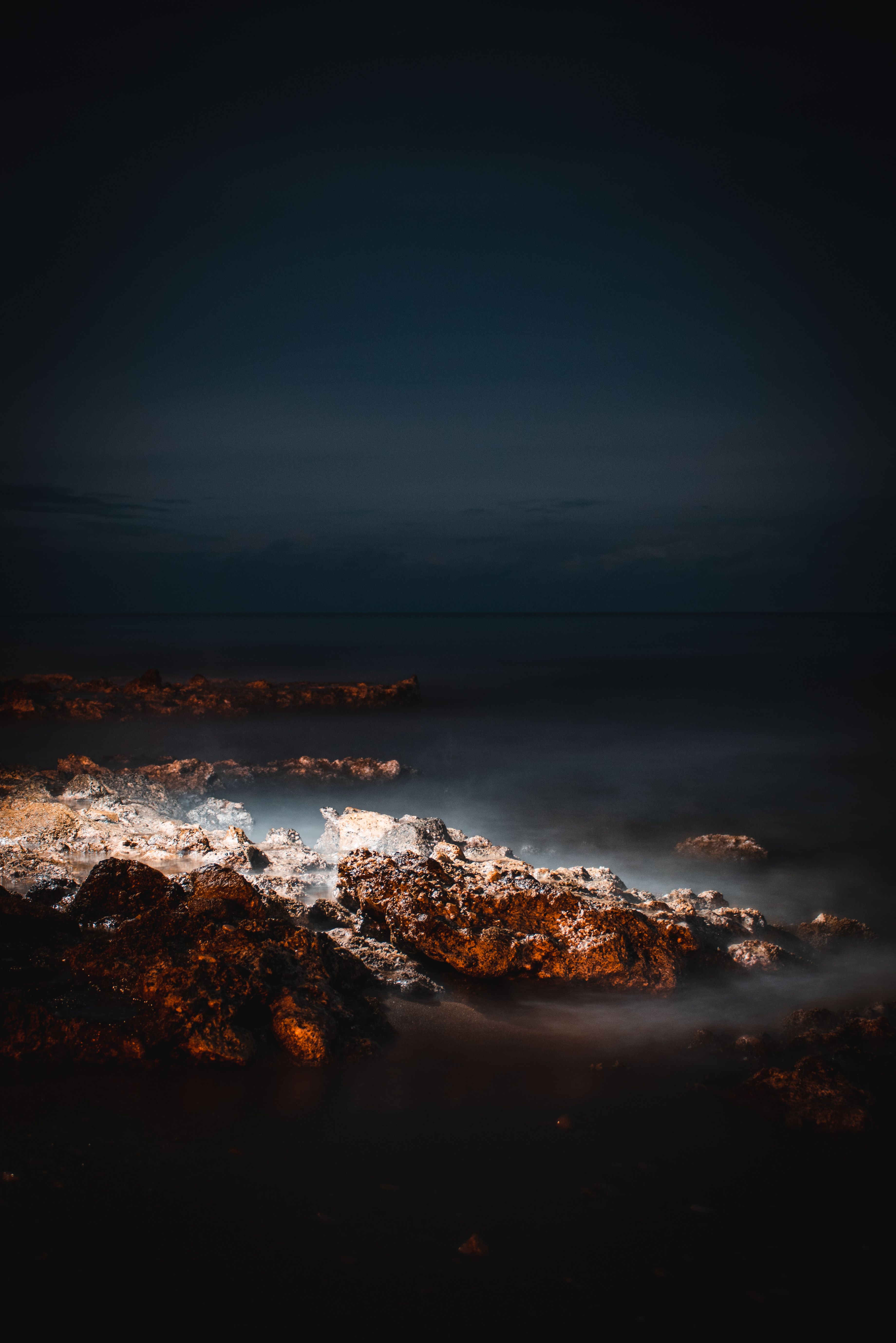 A Rocky Shore at Night · Free Stock Photo