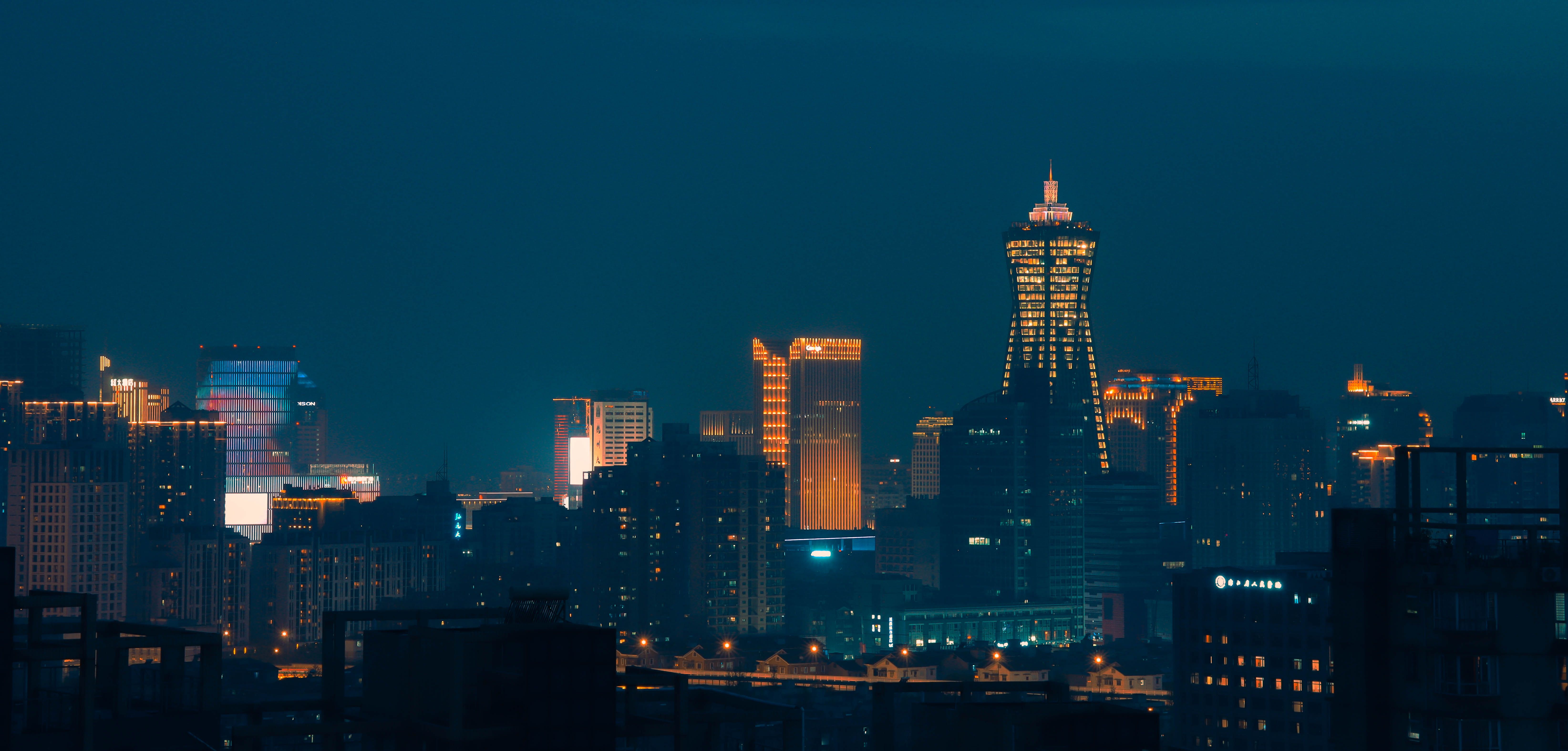 Downtown City Buildings in Lights at Night · Free Stock Photo