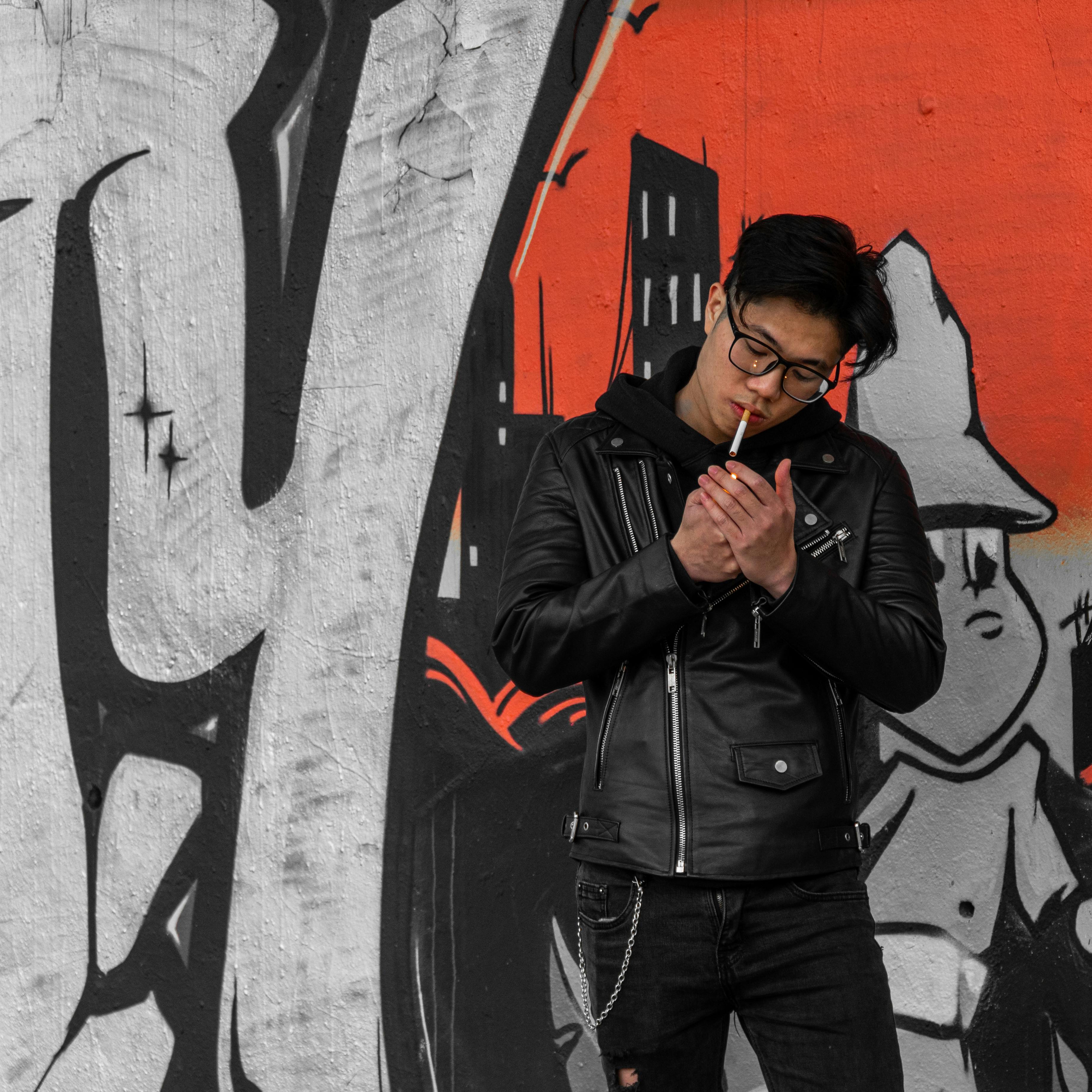 Man in Black Leather Jacket smoking Cigarette 