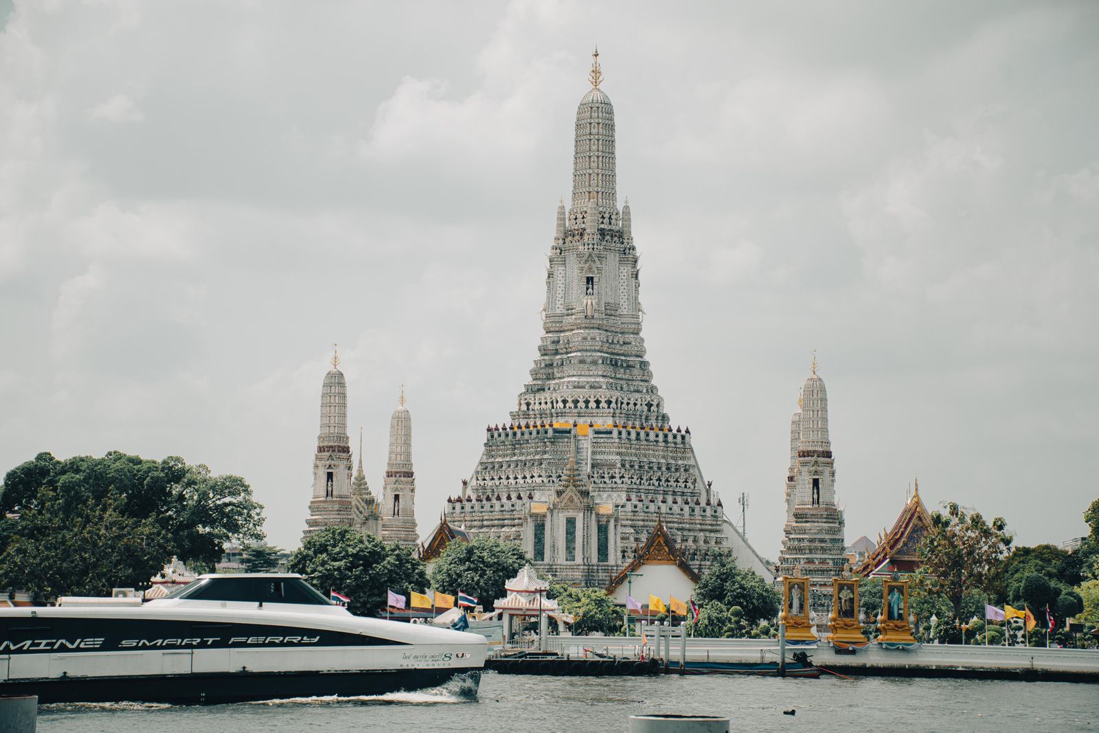 Early morning light on the river makes for the clearest view of the temple's intricate spires.