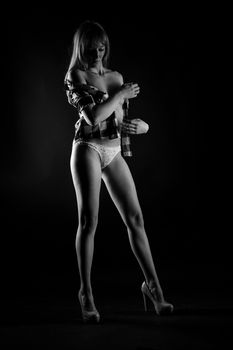 Stunning black-and-white photo of a woman posing elegantly in lingerie, highlighting style and sophistication.