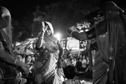 Free Grayscale Photography of Women Dancing Together Stock Photo