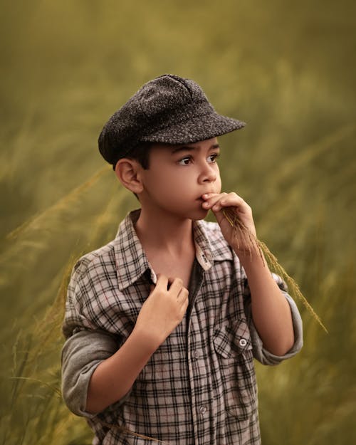 Free Boy in Checkered Top Wearing a Beret Hat Stock Photo