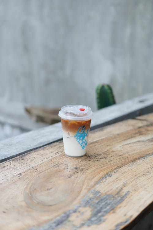 Plastic Cup with White and Brown Liquid