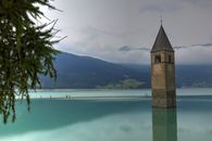 Brown Concrete Building Near Body of Water