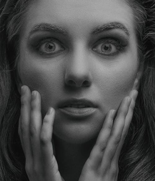 Face of a Woman in Grayscale Photography  