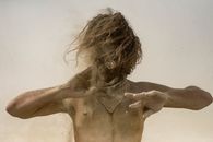 Topless Woman Standing on Sand