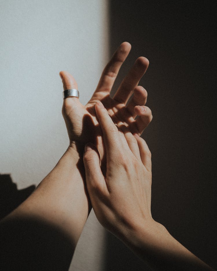 Close Up Of Hands Touching